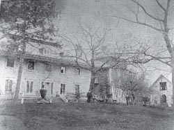 View of the front of the manor house, the library tower and the front of the family museum, circa 1893