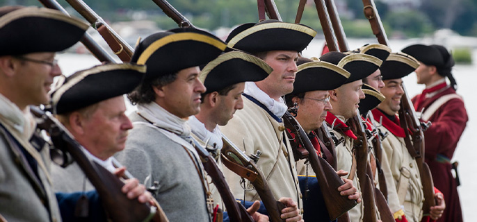 Men wearing French soldier costumes at Fort Chambly National Historic Site.