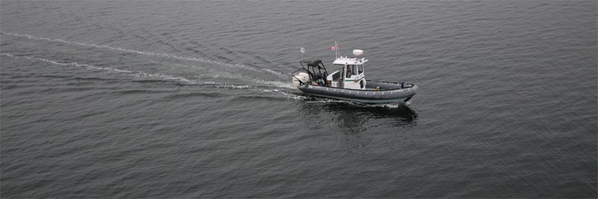 Shot of a Parks Canada inflatable boat navigating on calm waters.