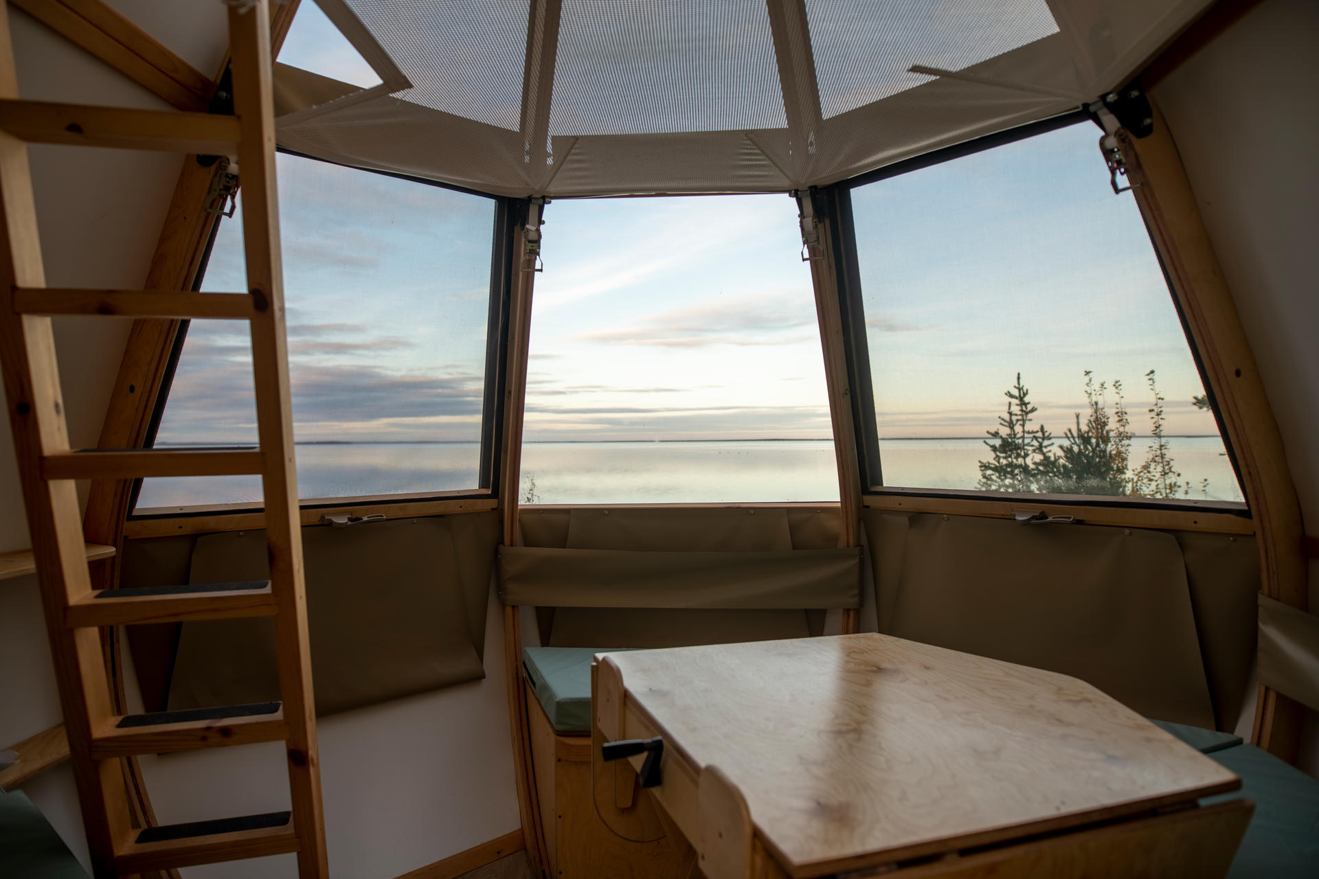 Inside shot of the Ôasis accommodation with beach background.