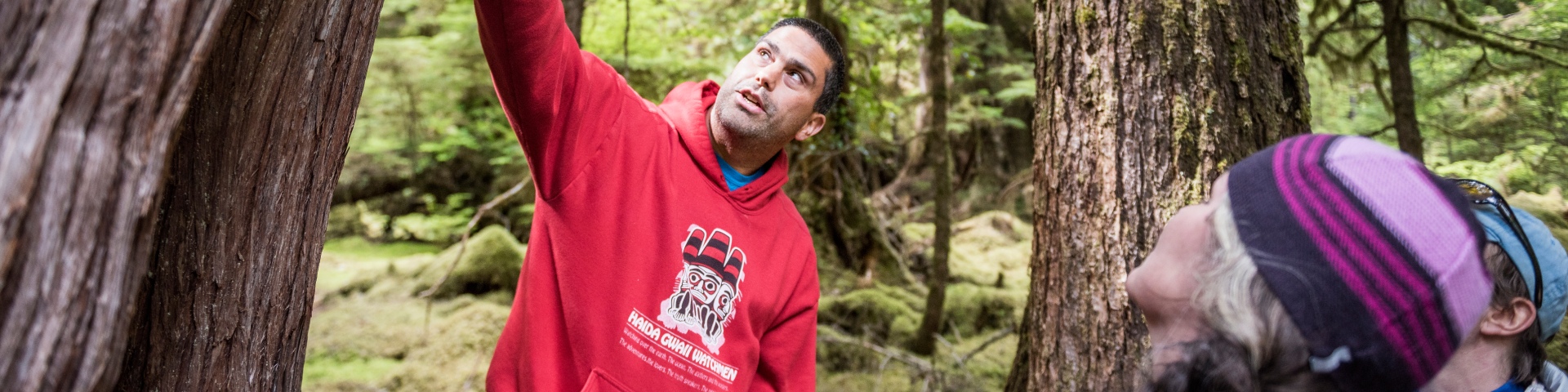 Watchmen at Hlk'yah GawGa (Windy Bay) lead visitors on a guided tour through old growth forest in early July.