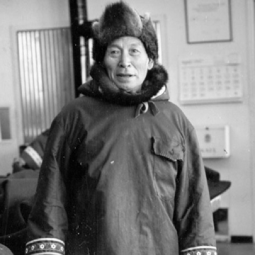 Black and white portrait of a man wearing winter clothing
