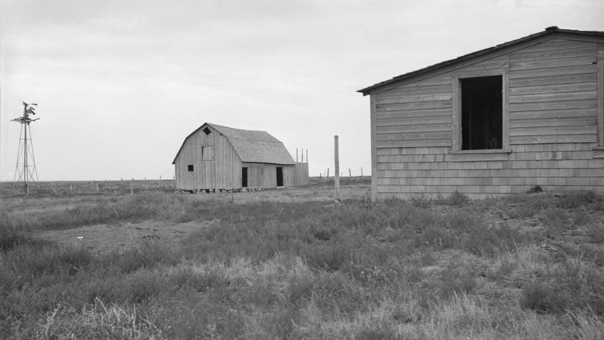 Deserted farm buildings during droughts in southeastern Alberta, 1937