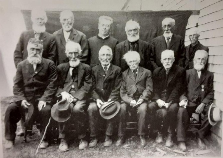 Group of men, approximately 50 years after the Caraquet Riot of 1875, including some former rioters