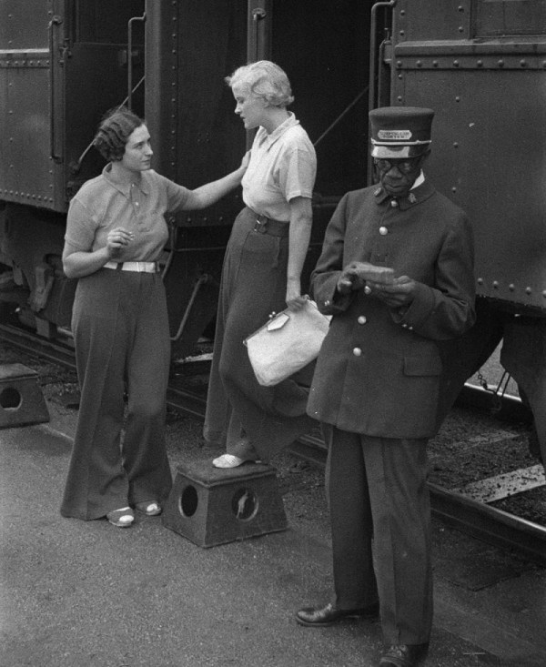 A Canadian Pacific Railway Black railway porter at a stop, 1933