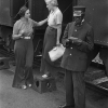 A Black railway porter at a short stop, 1933