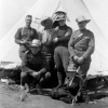 Group of uniformed army personal in front of a tent, circa 1914