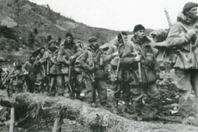 Historical photo of Canadians marching in line during the Korean War