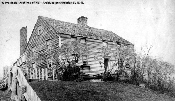Black and white image of a wooden house