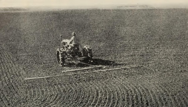 Page from a report showing a person operating farm machinery in a field