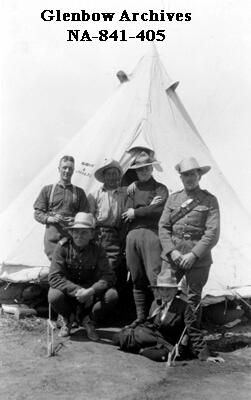 Group of army personnel in front of tent, circa 1914