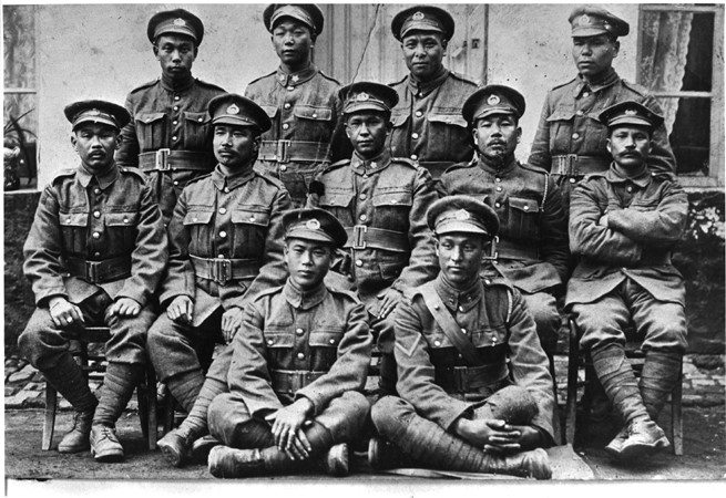 Black and white photo of a group of soldiers in uniforms