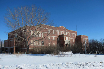 Large building with snow on the ground