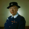 A women's portrait, wearing a uniform