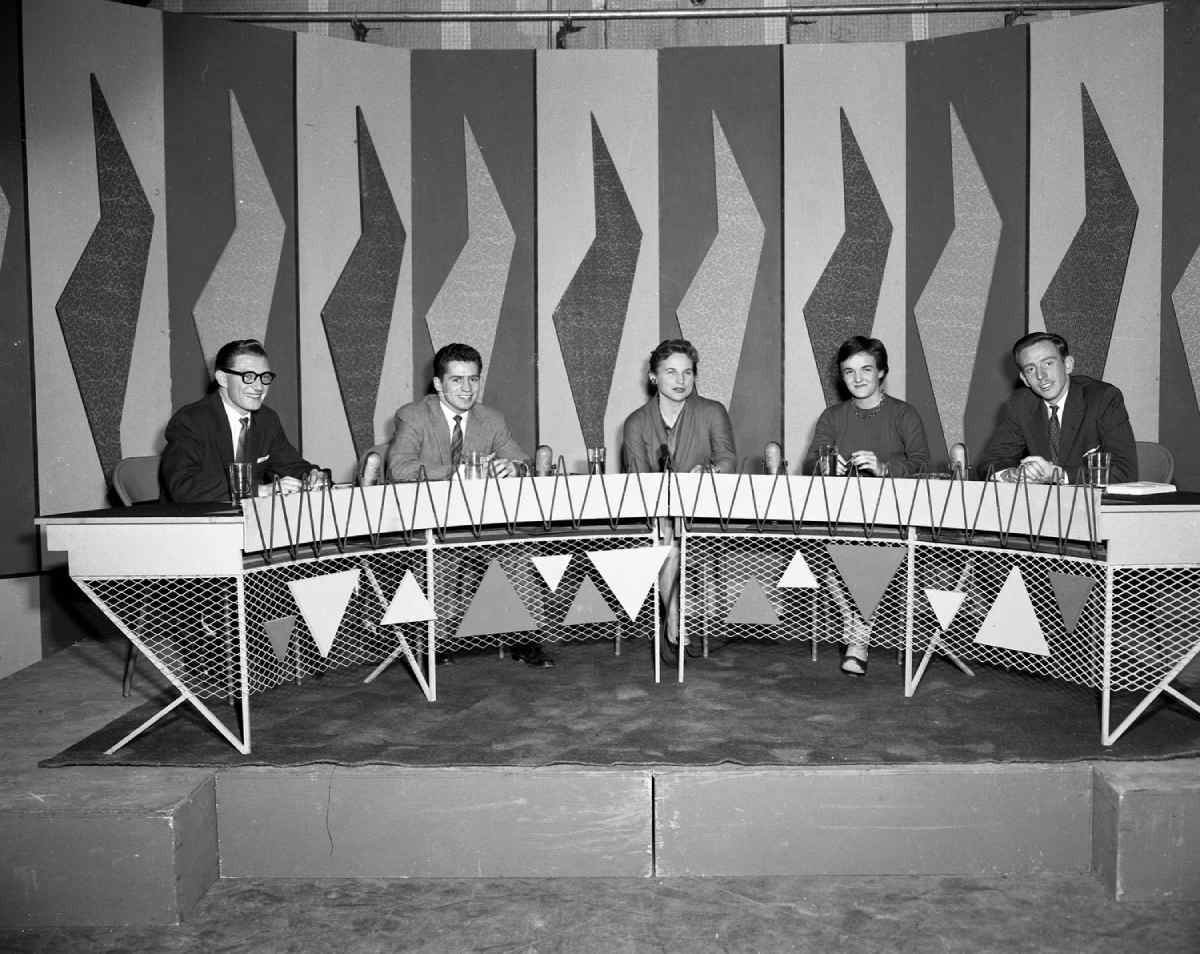 People sitting at a table during the recording of the Opinion show at CBOFT, with Jeanne Sauvé, 1956