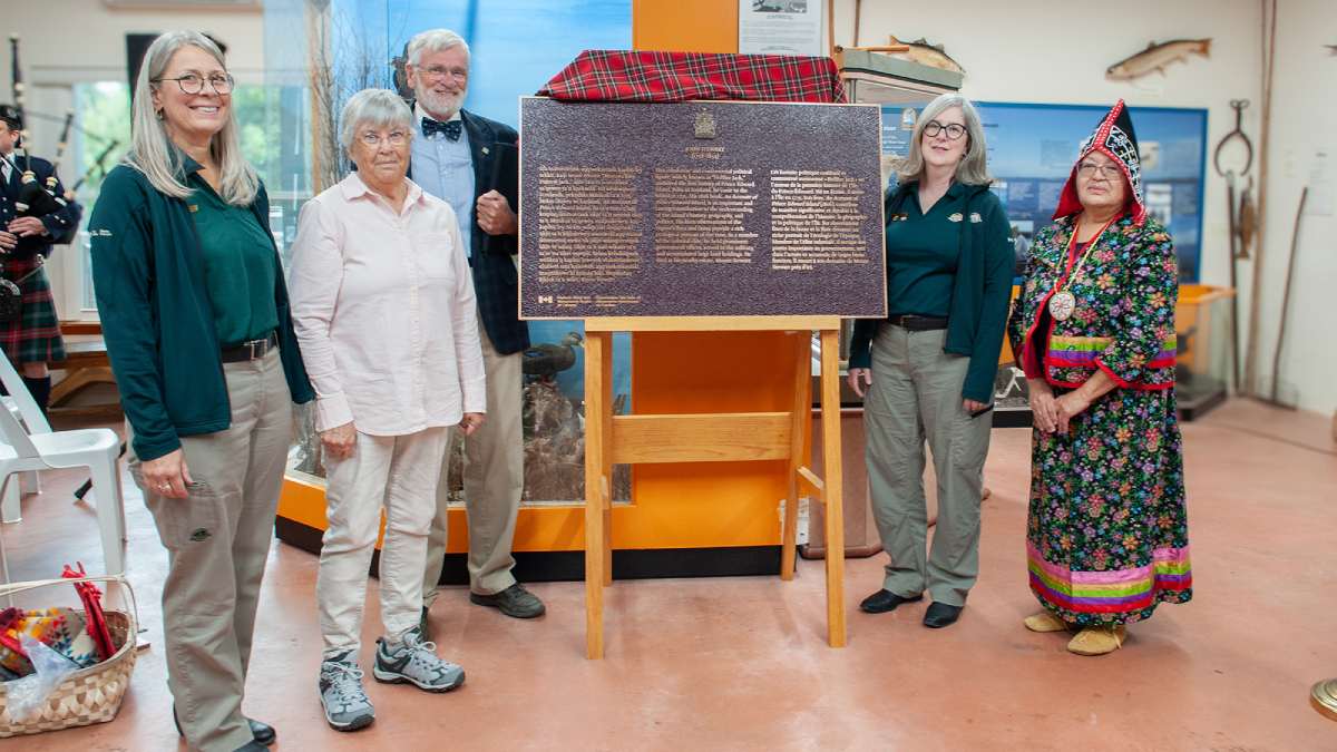 Group of people surrounding a commemorative plaque for the historical importance of John Stewart (1758-1834)