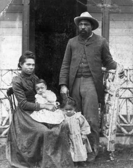 A man and a women with two kids