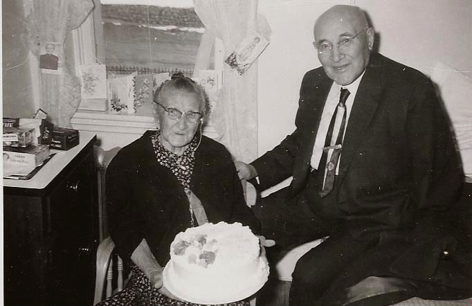 Historic black and white image of two elderly people