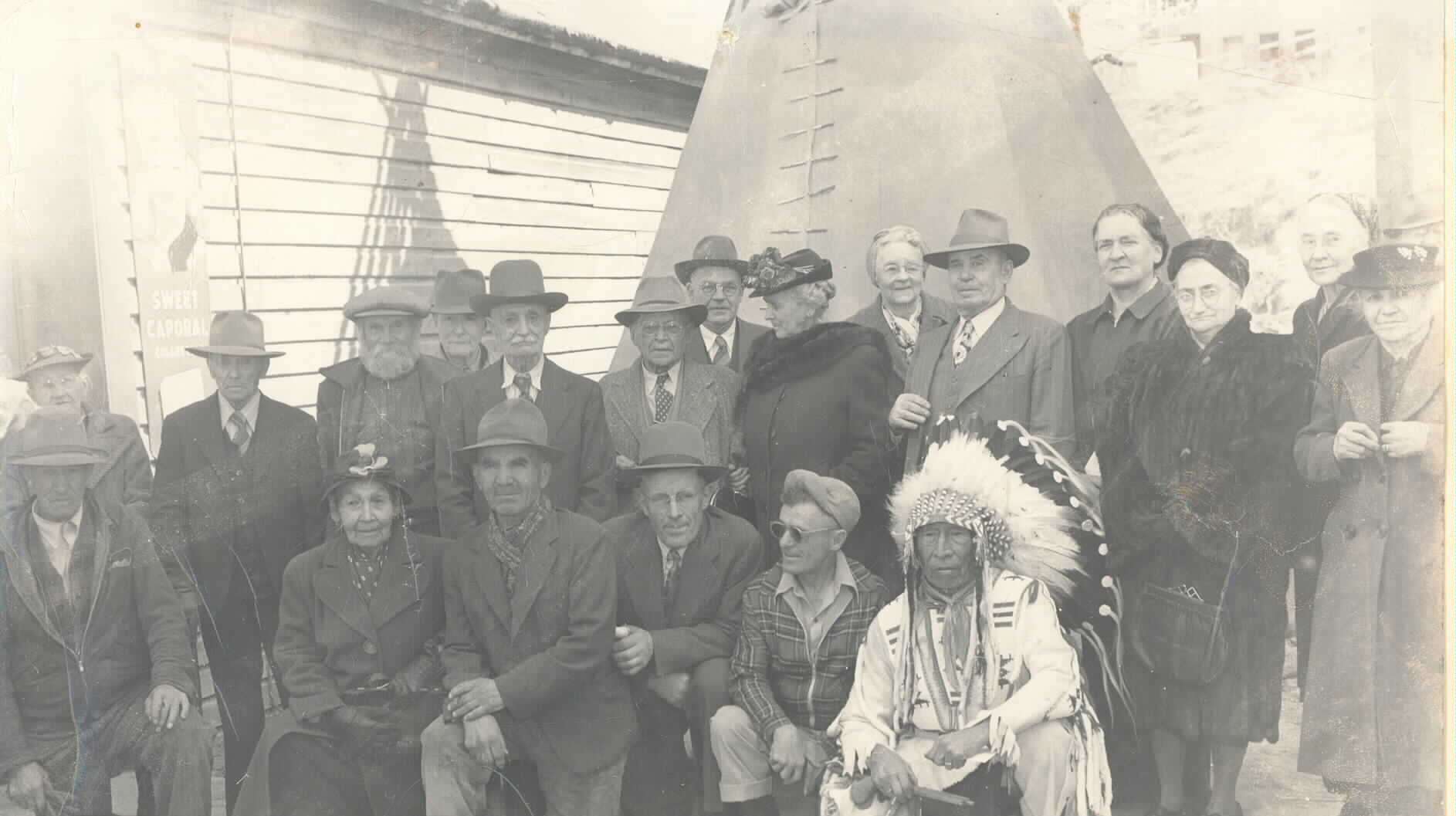 Historic black and white image of group of people