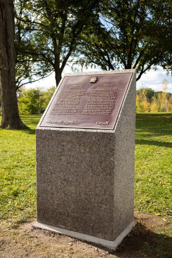 Commemorative bronze plaque on a stand