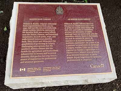 A bronze commemorative plaque on the ground