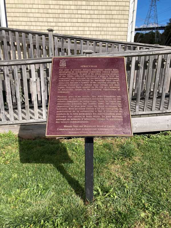 A bronze commemorative plaque on its stand