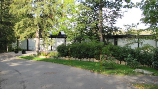Front elevation of the Hart Massey house with trees and blue sky, 2017, Ottawa Ontario