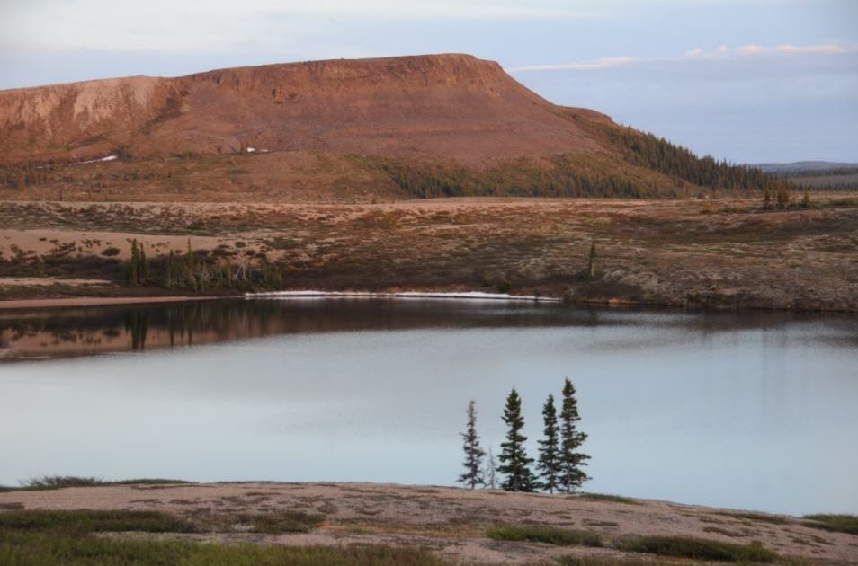 Image of a landscape showing water and a mountain