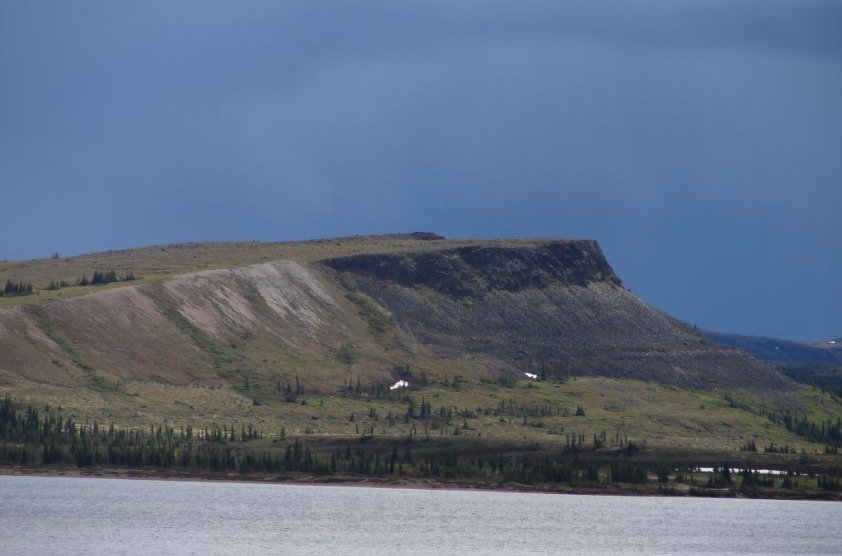 Image of a landscape showing water and a mountain