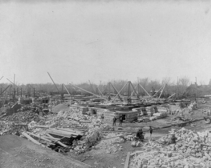 Black and white photo of a field, representing the Victoria Memorial Museum under construction in Ottawa, Ontario