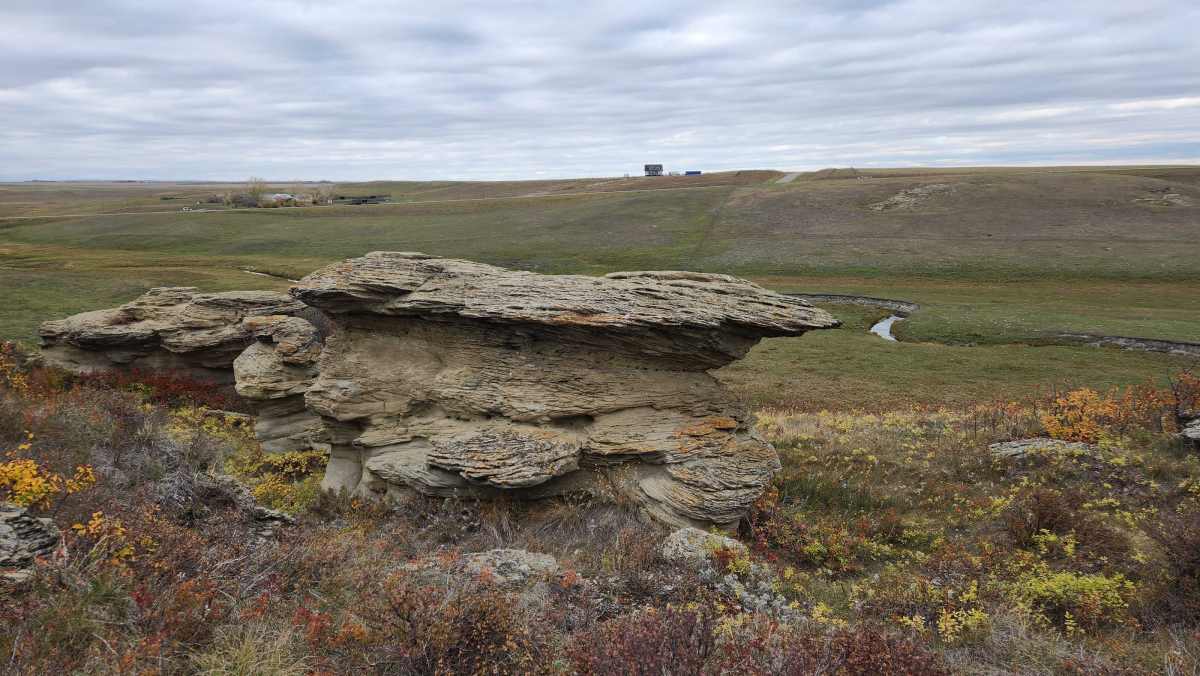 Landscape with rocks, grass and hills