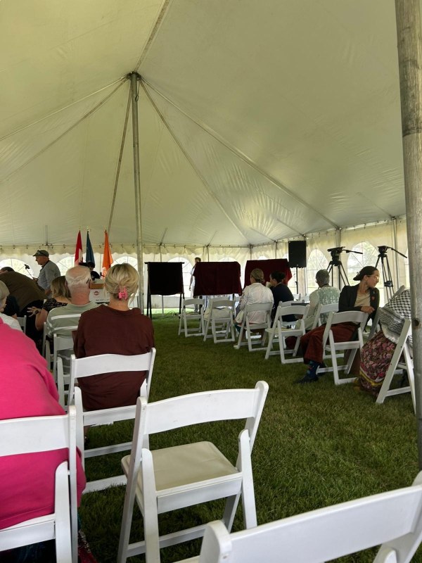 A marquee with chairs and guests