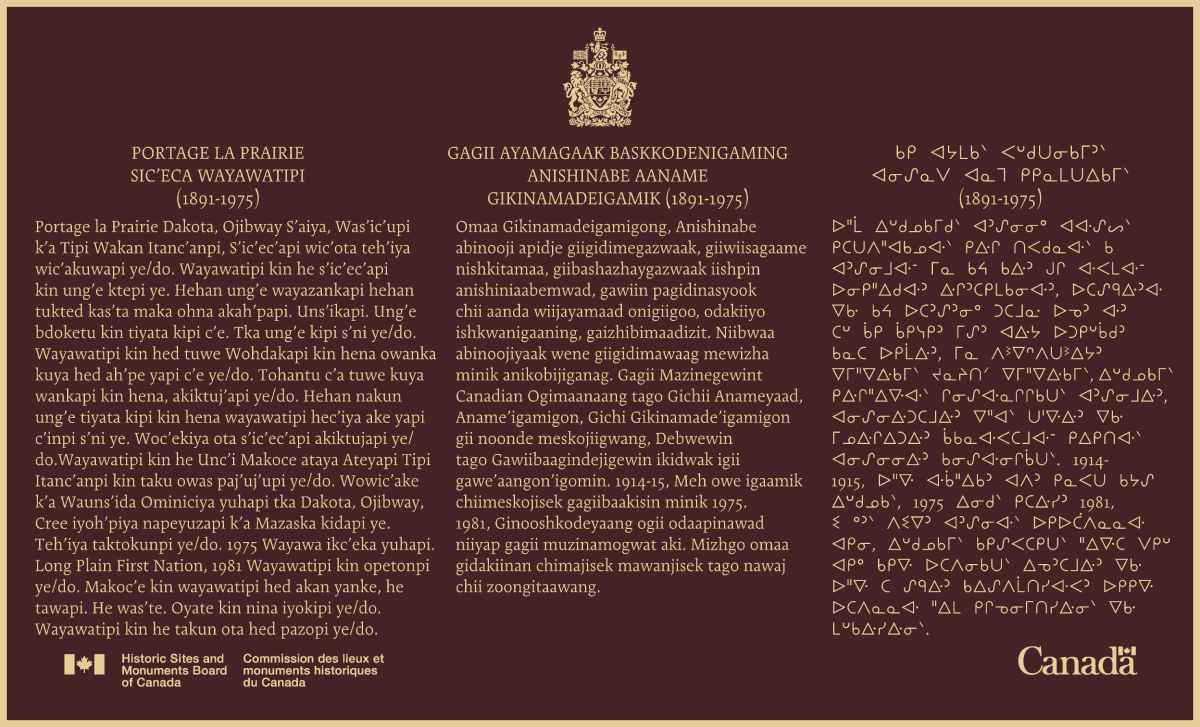 Commemorative plaque highlighting the historical significance of the former Portage La Prairie Indian Residential School National Historic Site, written in Anishinaabemowin, Dakota and syllabics