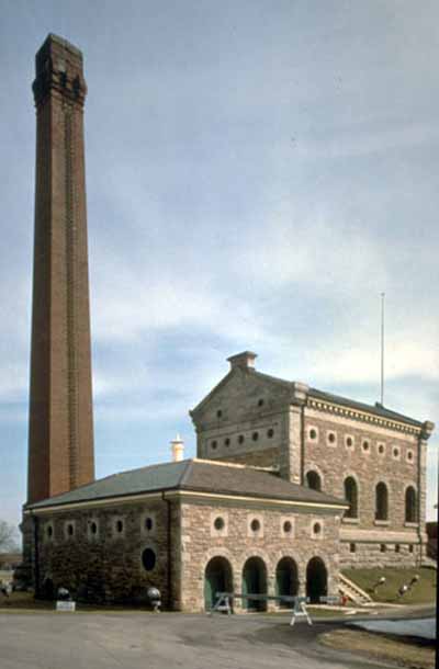 Waterworks with chimney on a blue sky background