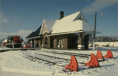 Railway station covered in snow with blue sky