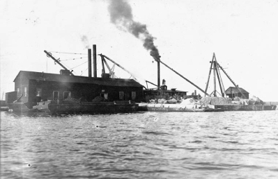 Black and white photo of construction of railway station bridge