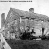 Black and white image of a wooden house