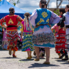 Women dance in colorful dresses