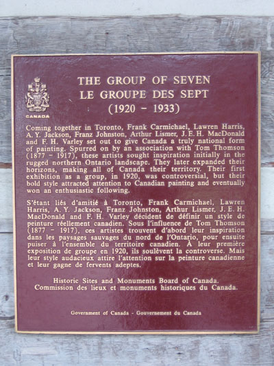 Commemorative bronze plaque installed on a brick wall