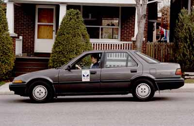 Photo of a car in front of a house