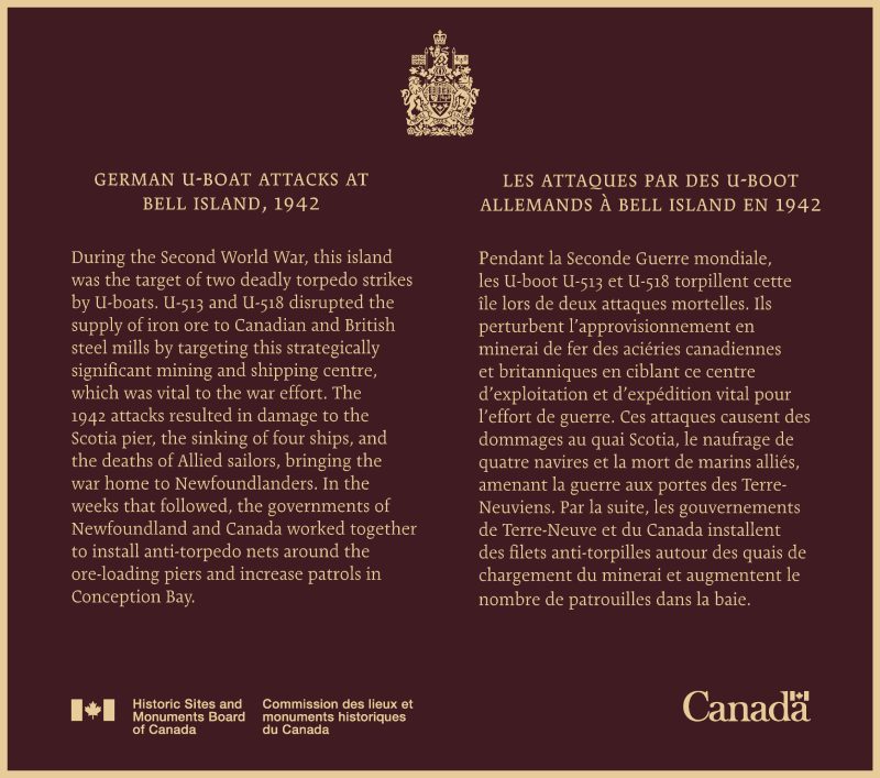 Commemorative bronze plaque with yellow text written on it