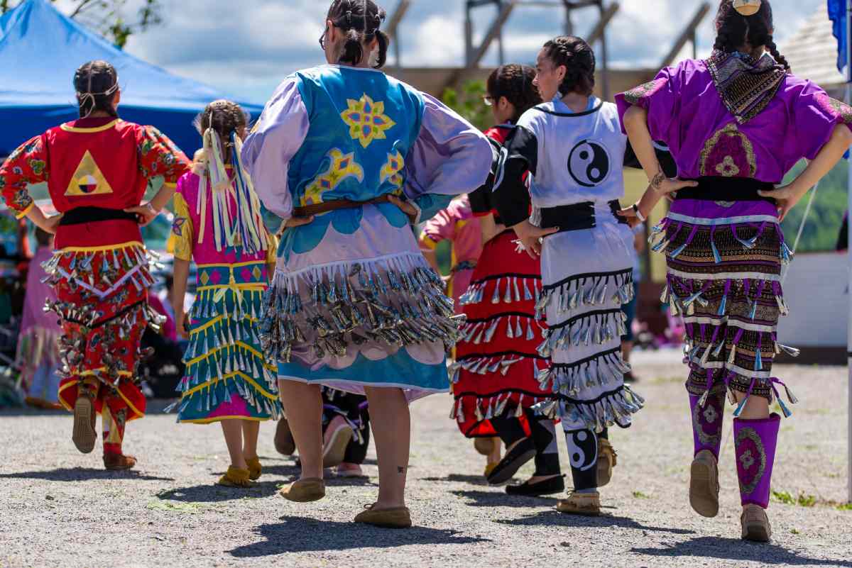 Women dance in colorful dresses