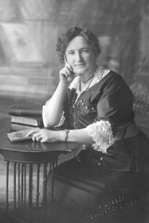 Black and white image of a woman sitting 