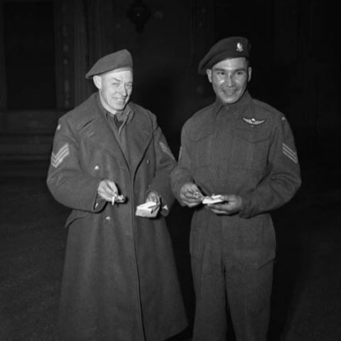 Two men standing beside each other