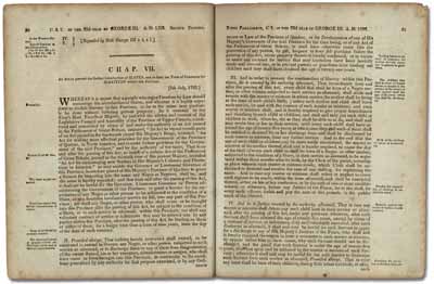An old book opened to pages full of text