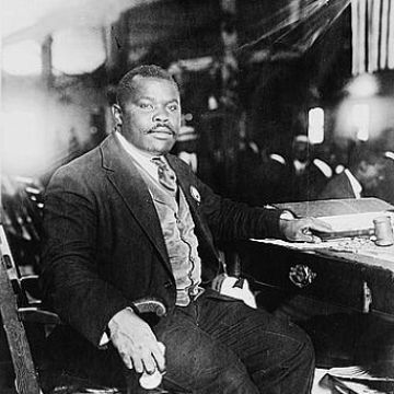 Historical photo of a man sitting at a desk