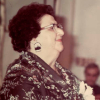 Side portrait of a woman in the 1970s smiling