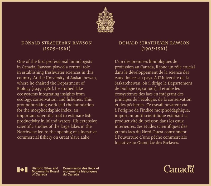 Bronze commemorative plaque with yellow text