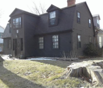 Photo of a large brown coloured house