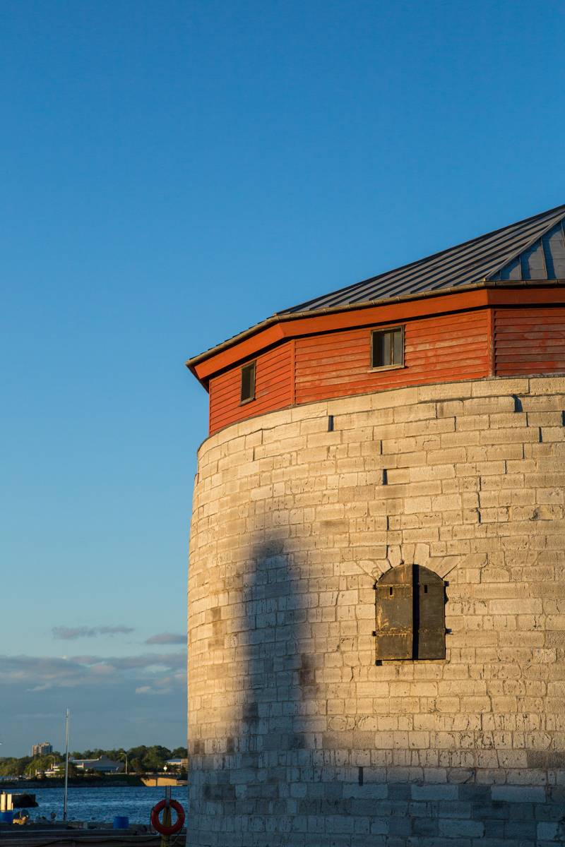 A circular tower beside the water